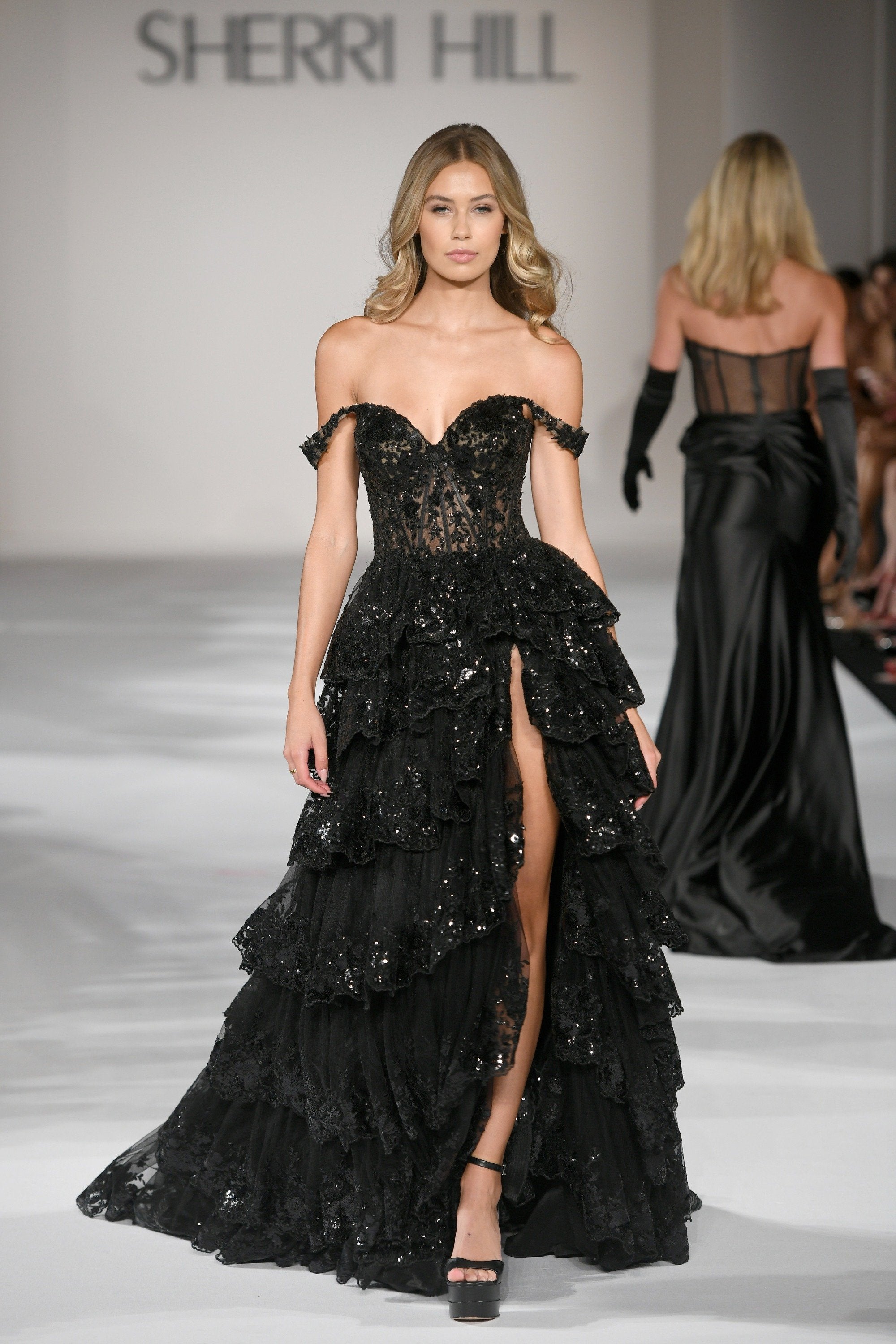 elegant black slit dress wiith sparkle detail